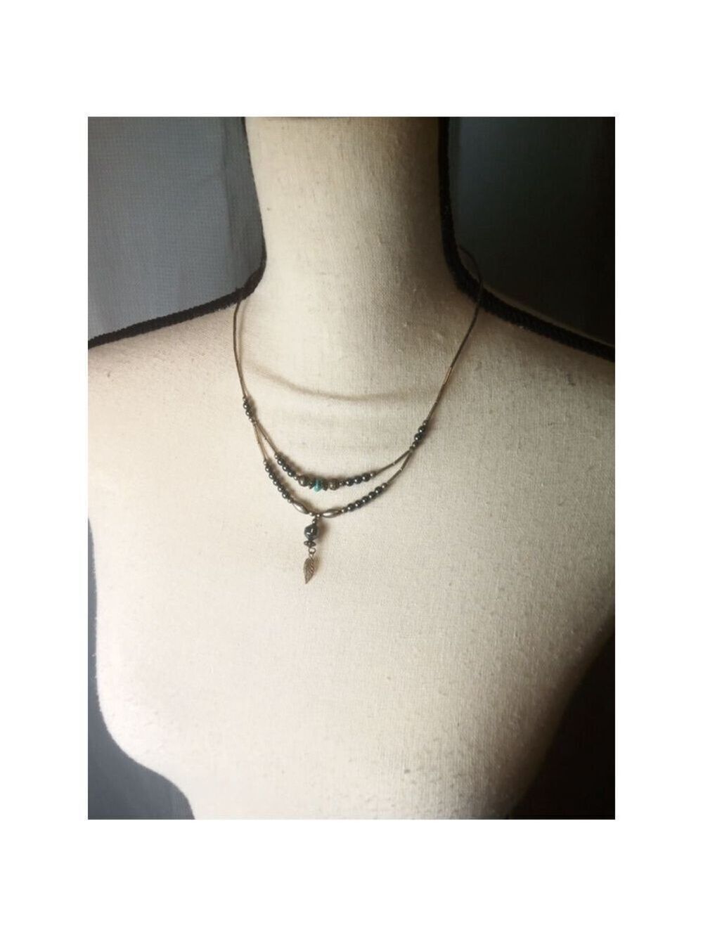 Necklace Black and Copper Beads with a Feather